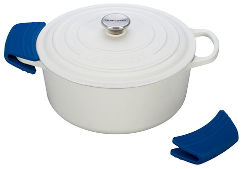 Le Creuset grips fitted on a Dutch oven handle demonstrating safe handling