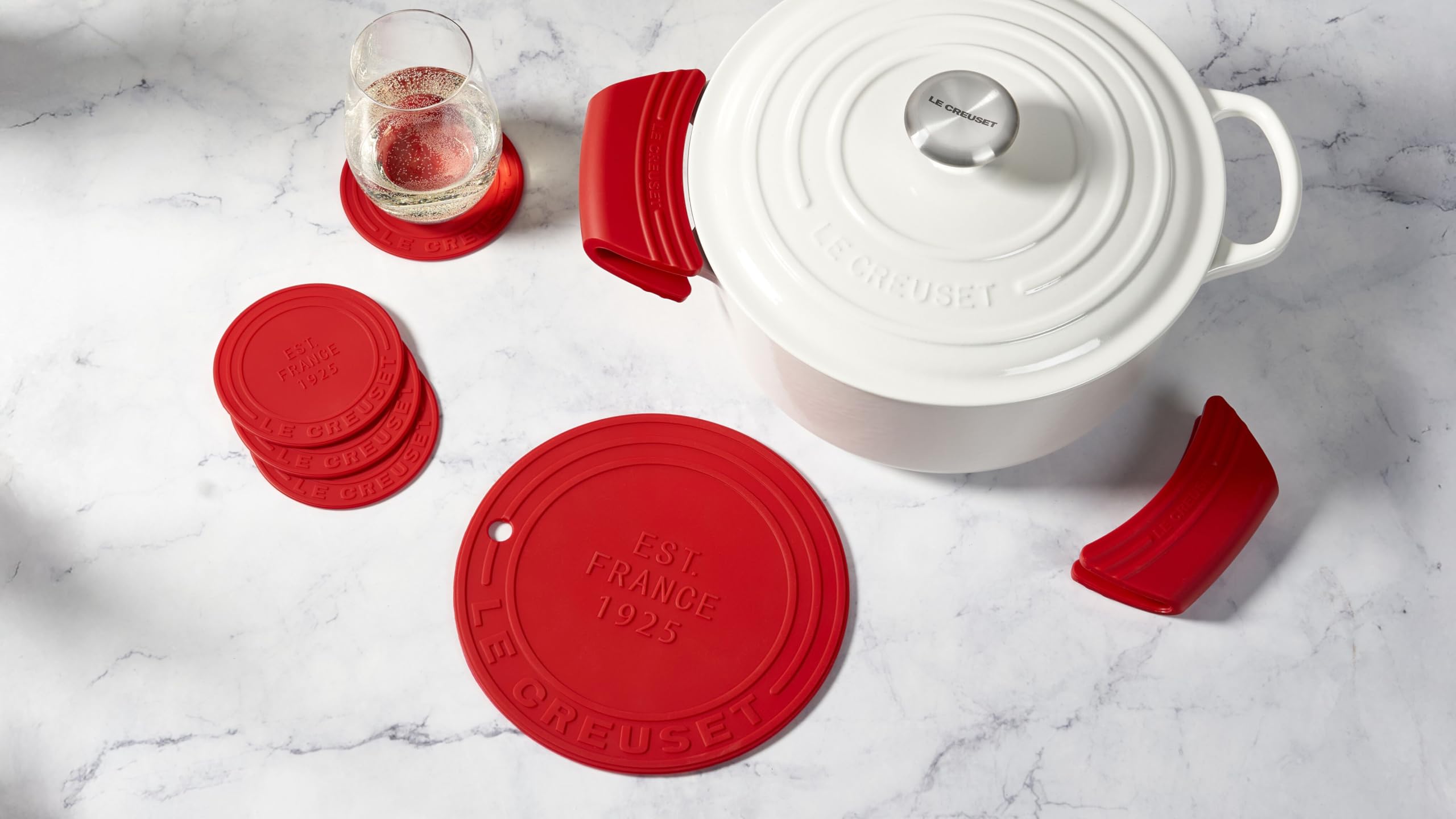 Le Creuset grips beside ruler showing 5-inch size for fit confirmation