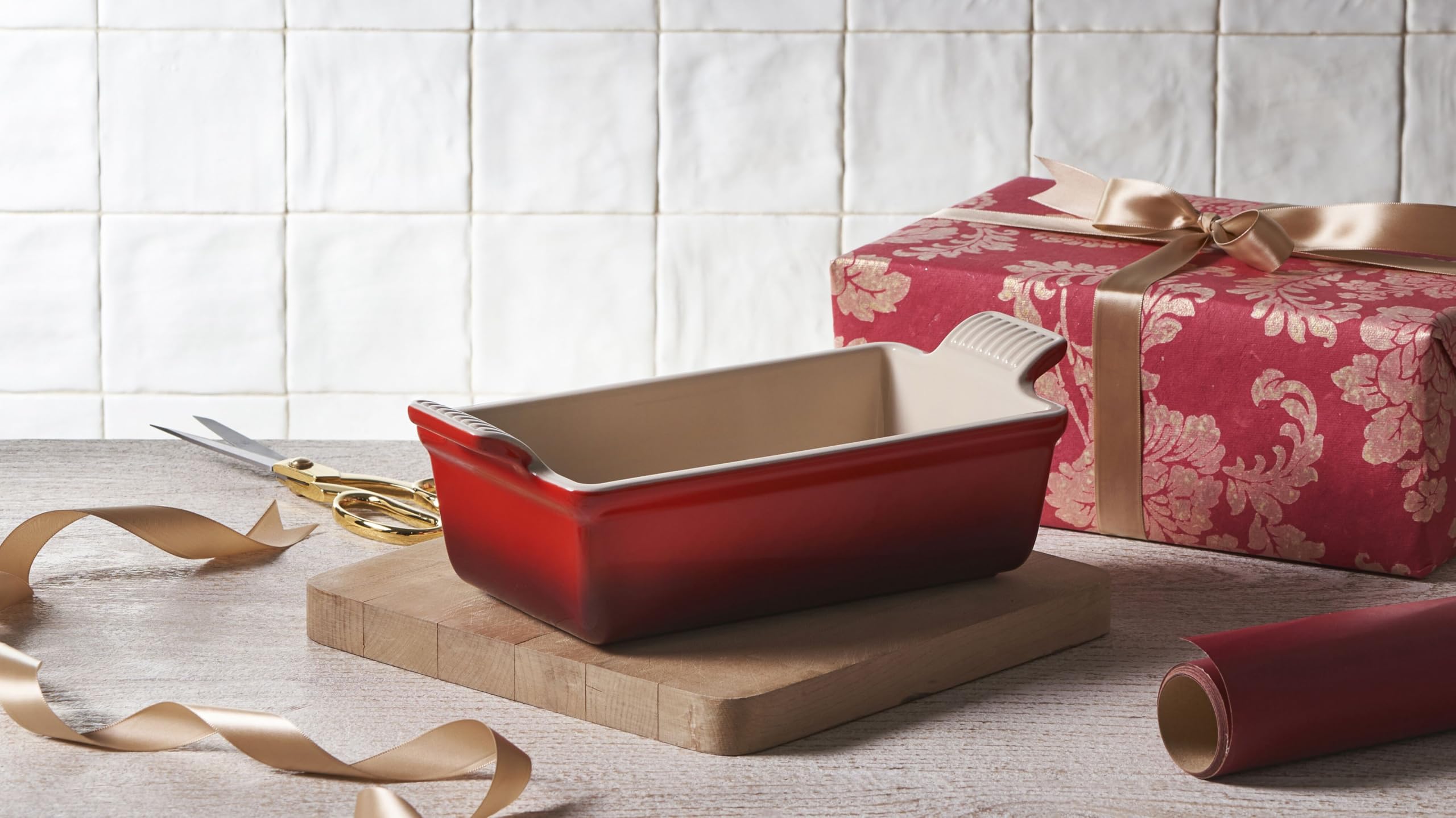 Le Creuset pan next to spoon showing compact 9x5x3 size and scale