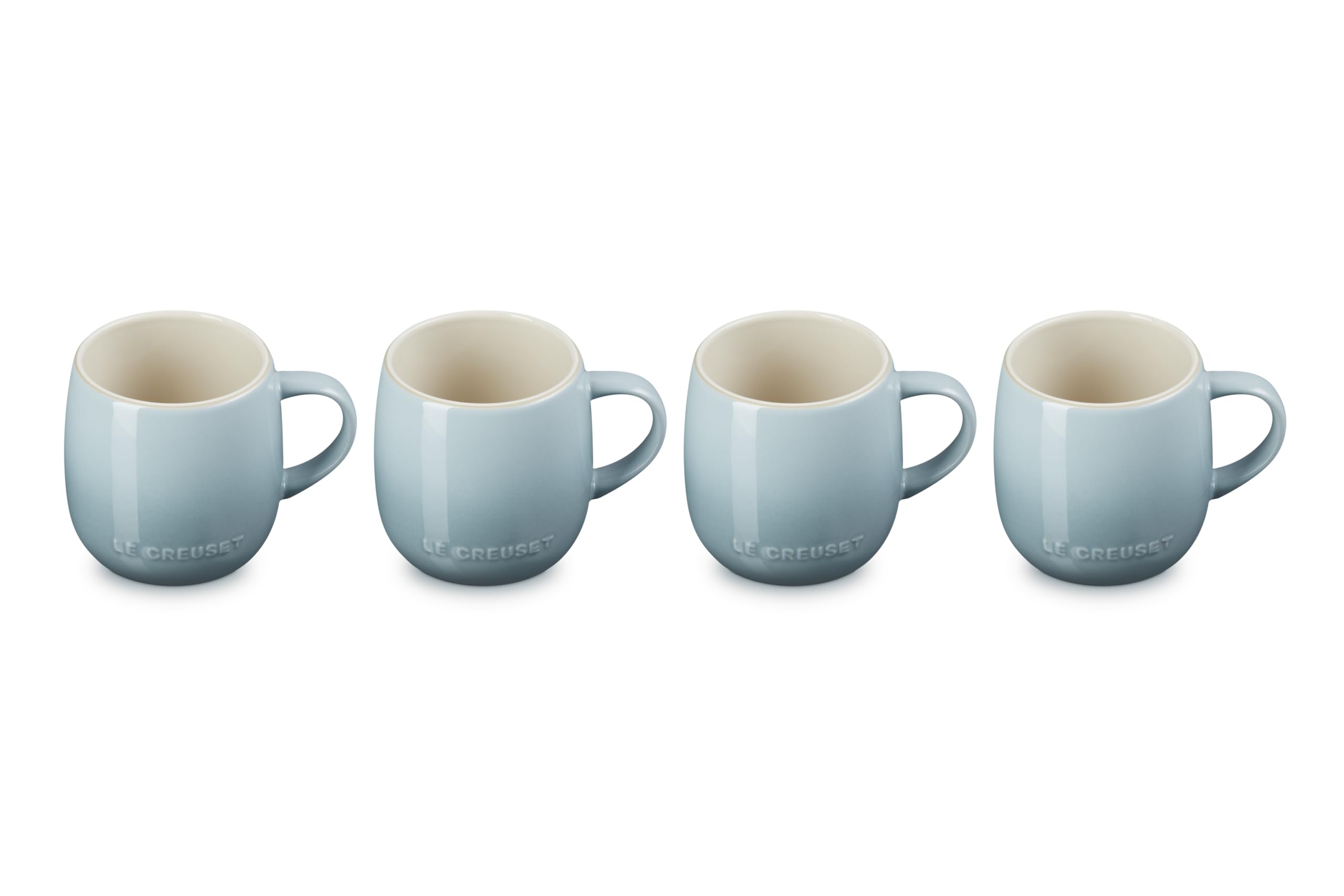 Le Creuset front view of four Sea Salt mugs showing elegant table presence
