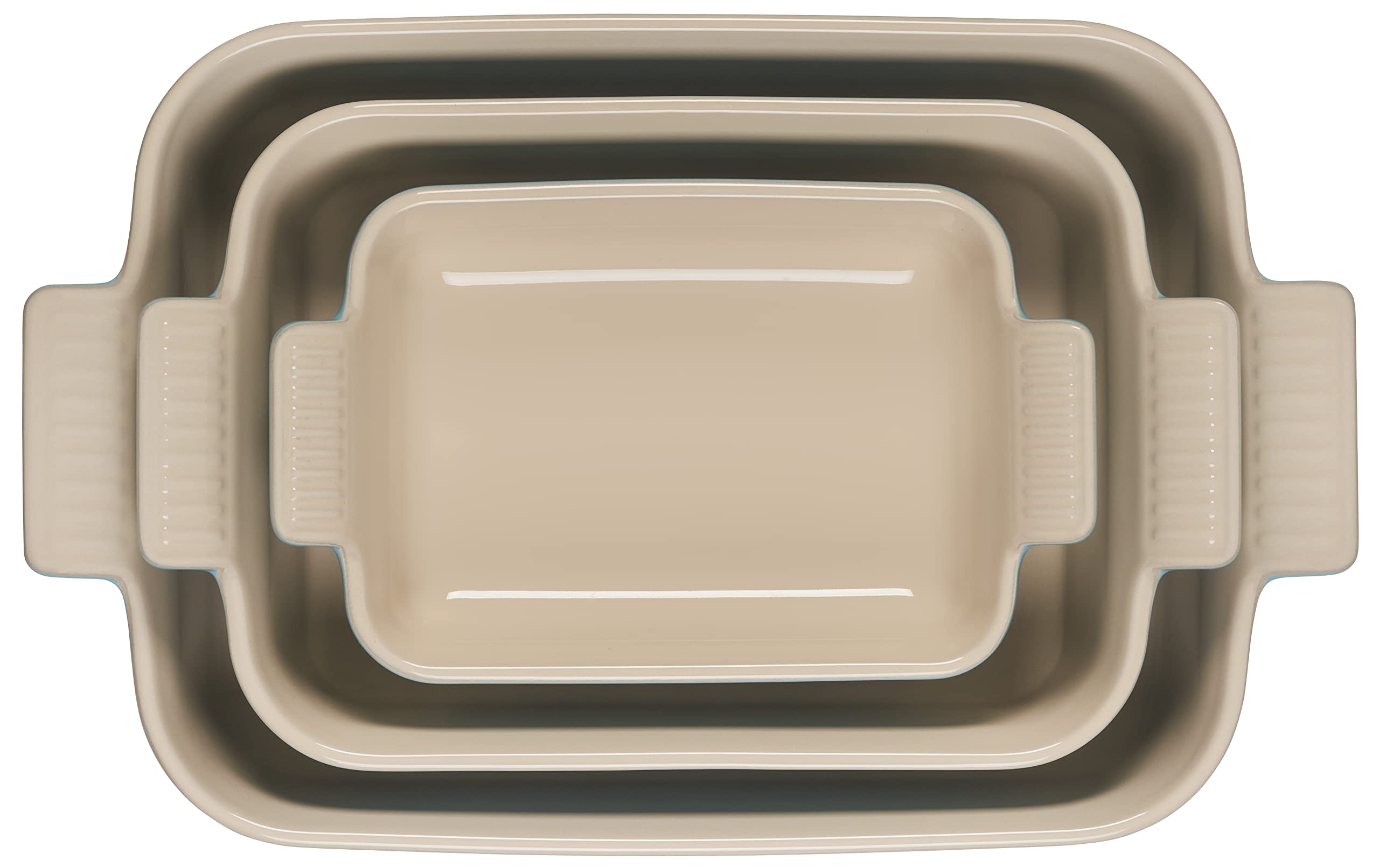 Le Creuset three dishes side-by-side filled showing size range and practical versatility