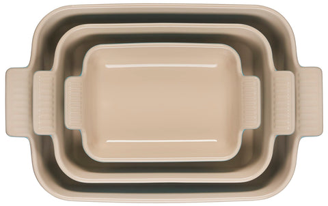 Le Creuset three dishes side-by-side filled showing size range and practical versatility
