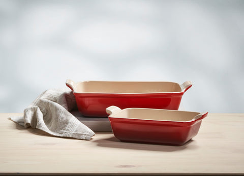 Le Creuset Cerise dish on table with roasted vegetables showing attractive serving presentation