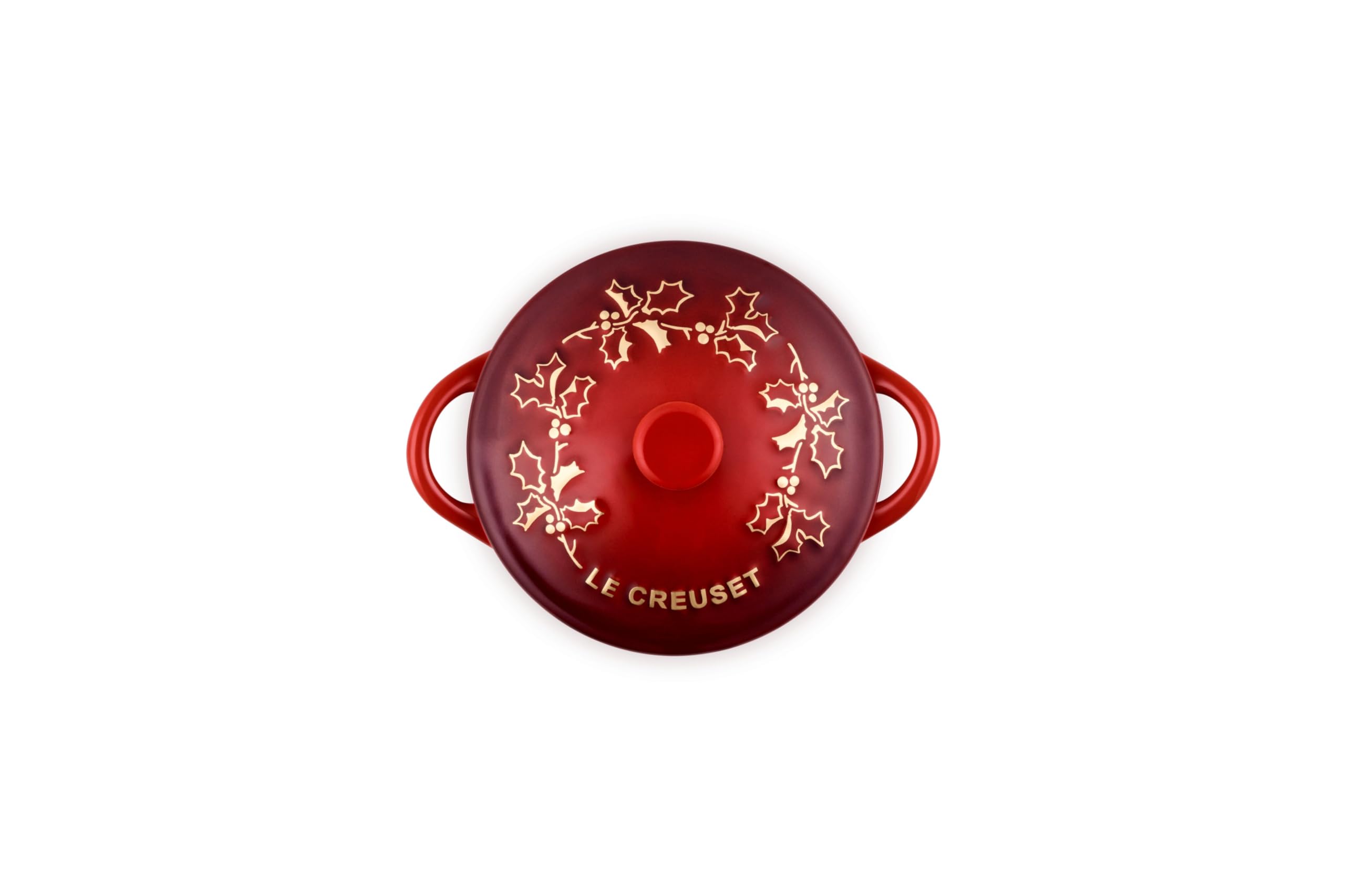Le Creuset holly applique close-up highlighting decorative detail and seasonal charm