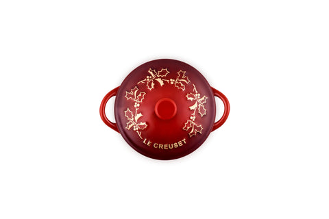 Le Creuset holly applique close-up highlighting decorative detail and seasonal charm