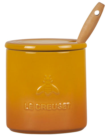 Le Creuset honey pot next to a mug showing compact 14 oz scale