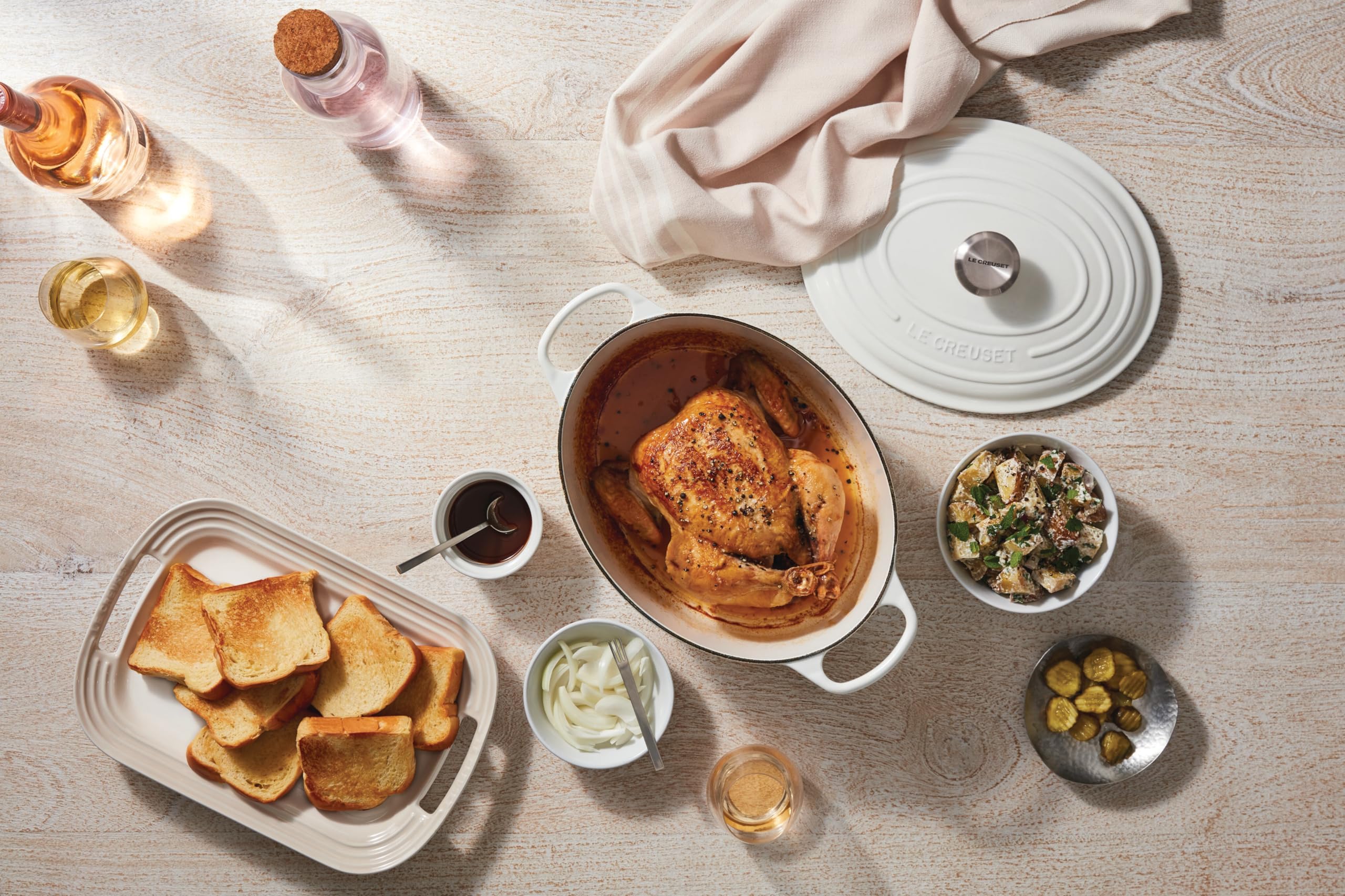 Le Creuset in use with roast chicken showing even browning and moisture retention