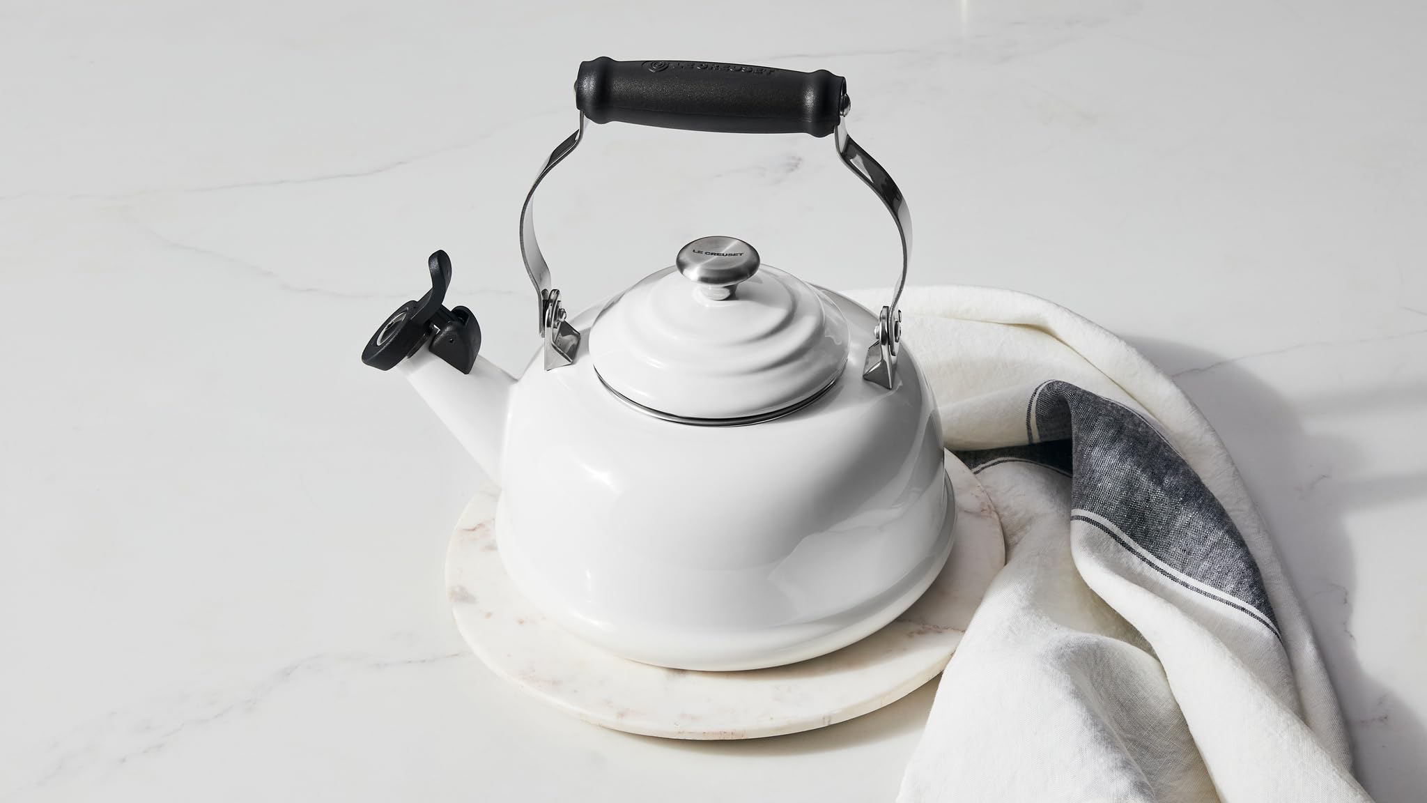 Le Creuset kettle on kitchen stove in Marseille adding color and quick boiling benefit