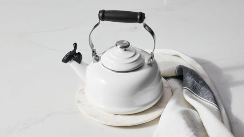 Le Creuset kettle on kitchen stove in Marseille adding color and quick boiling benefit