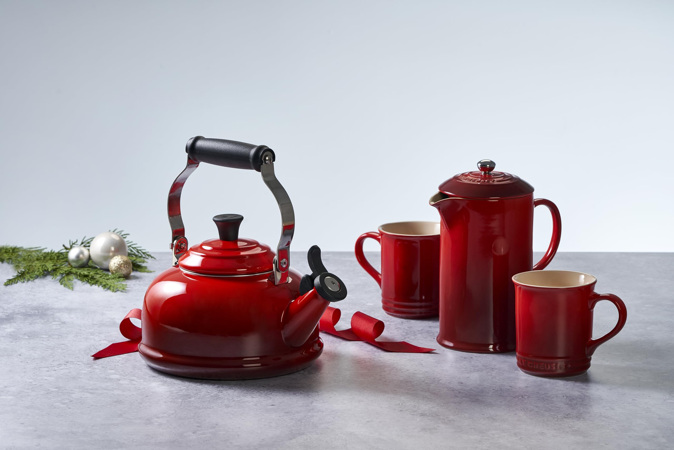 Le Creuset kettle on countertop in styled kitchen showing colorful everyday appeal