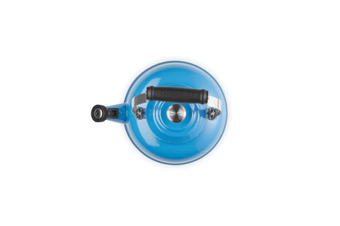 Le Creuset whistle detail showing fixed single-tone spout cover for audible boil alerts