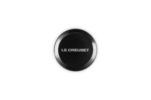 Le Creuset side profile of stainless steel knob showing ergonomic grip