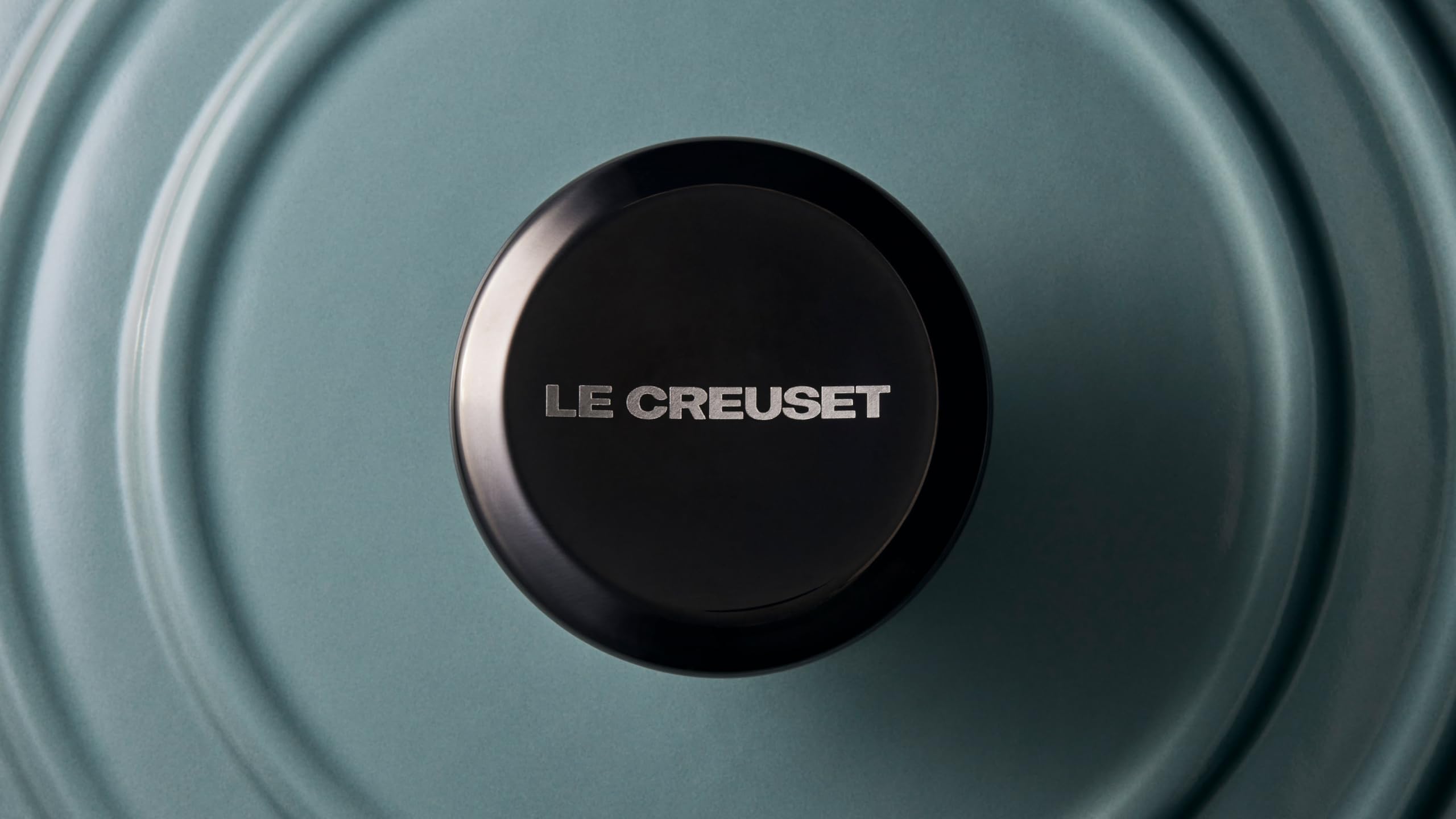 Le Creuset knob next to ruler showing 2.25 inch scale and fit