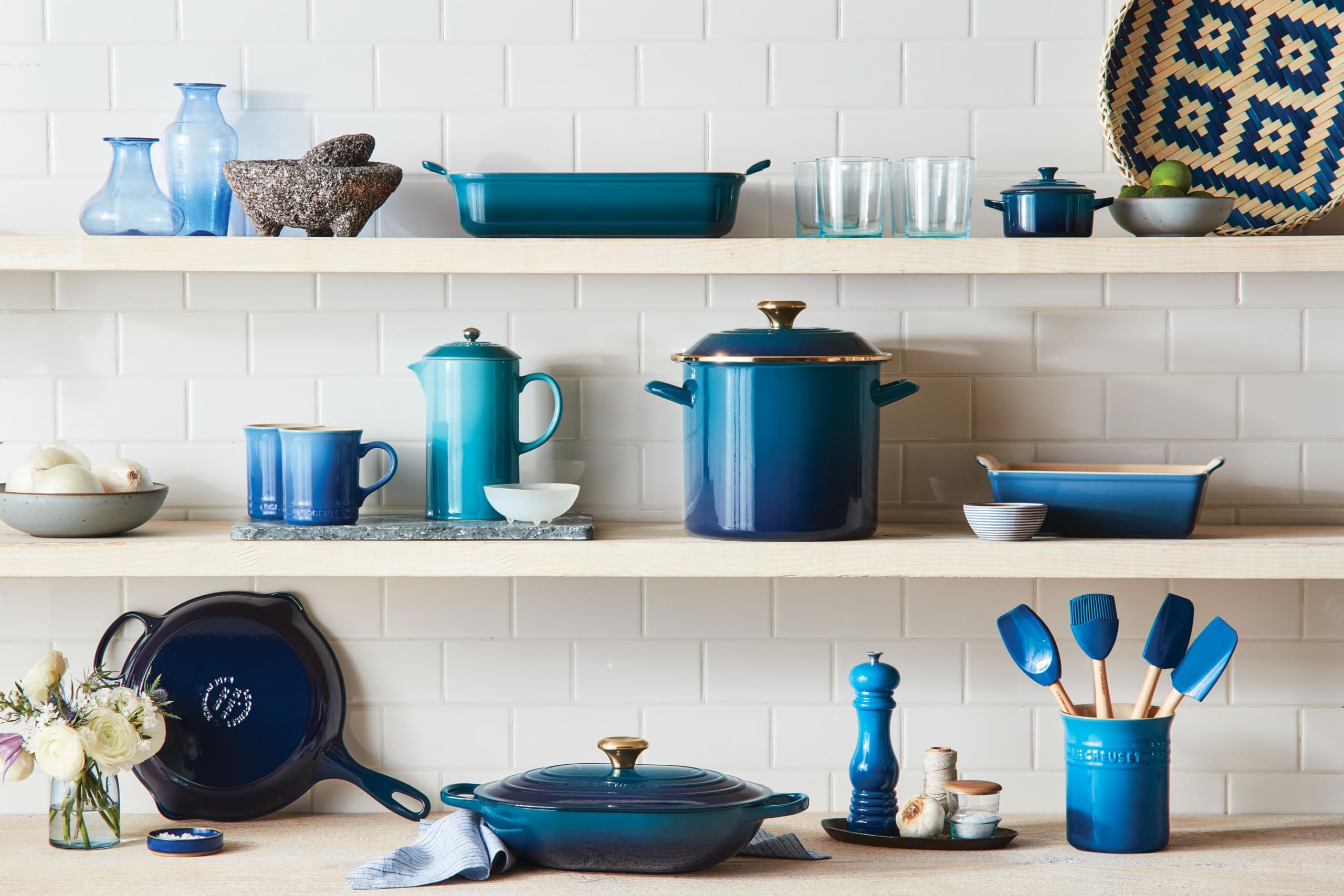 Le Creuset set on counter with measuring tape showing compact scale benefit