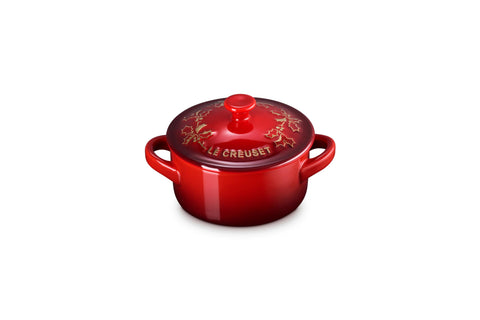 Le Creuset mini cocotte front view showing cerise color and lid for festive serving