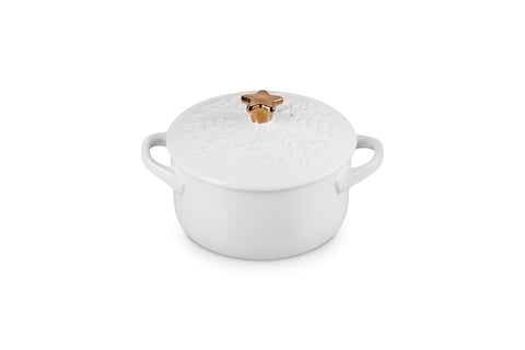 Le Creuset mini cocotte front view showing white finish and festive design for elegant serving