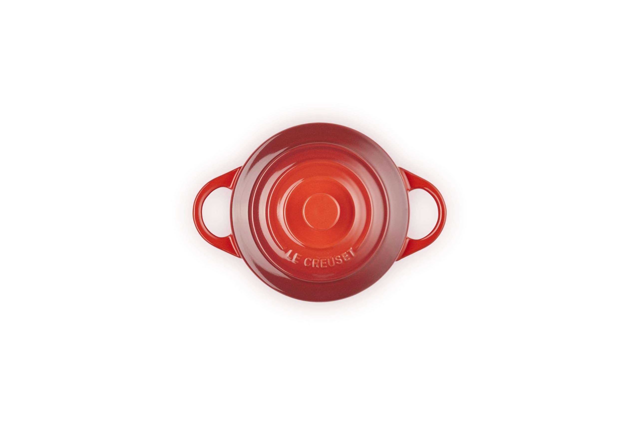 Le Creuset mini cocotte lid close-up showing glaze and secure fit for spill protection