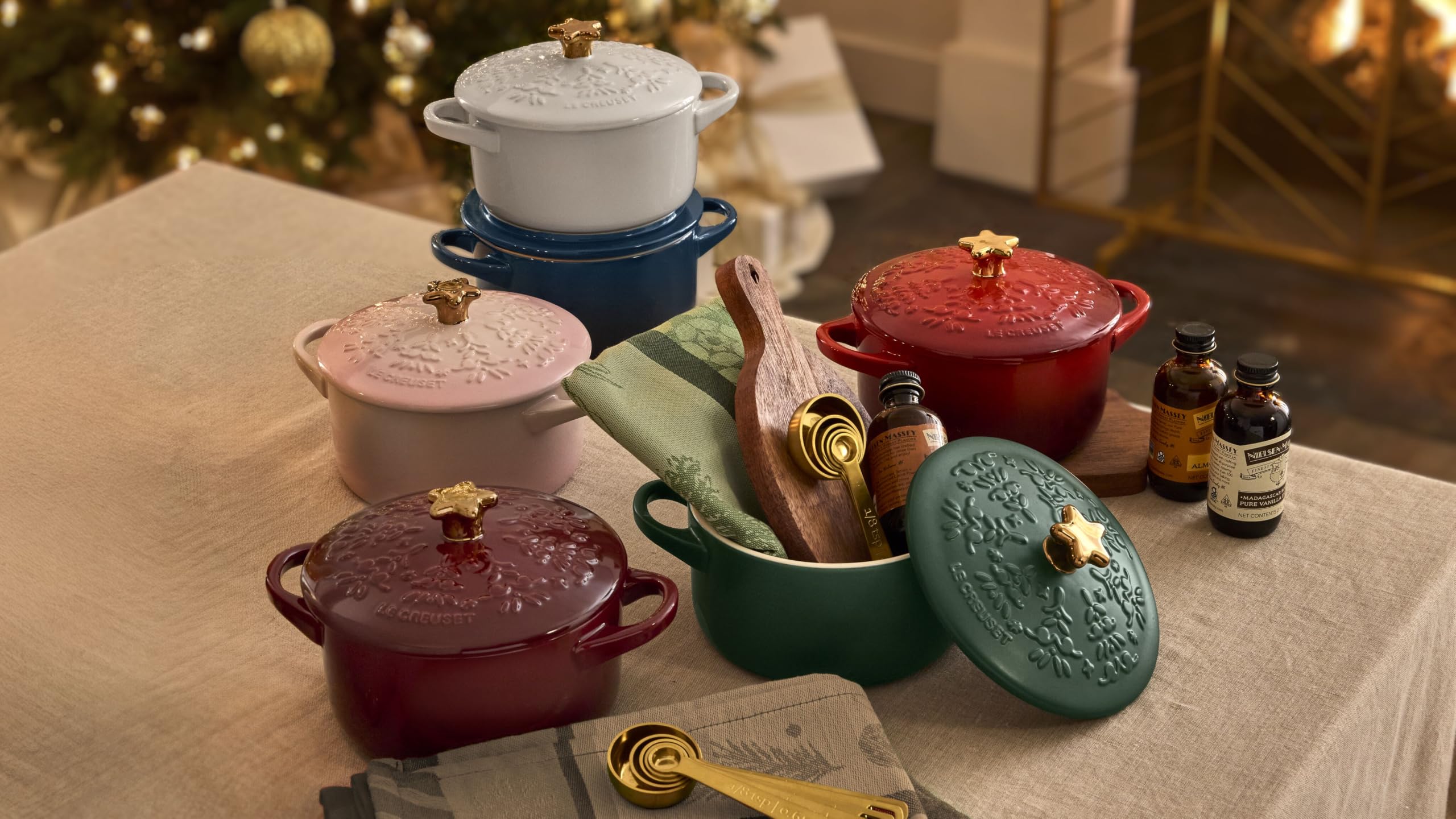 Le Creuset cocotte beside a hand and spoon showing 24-ounce scale for portion clarity