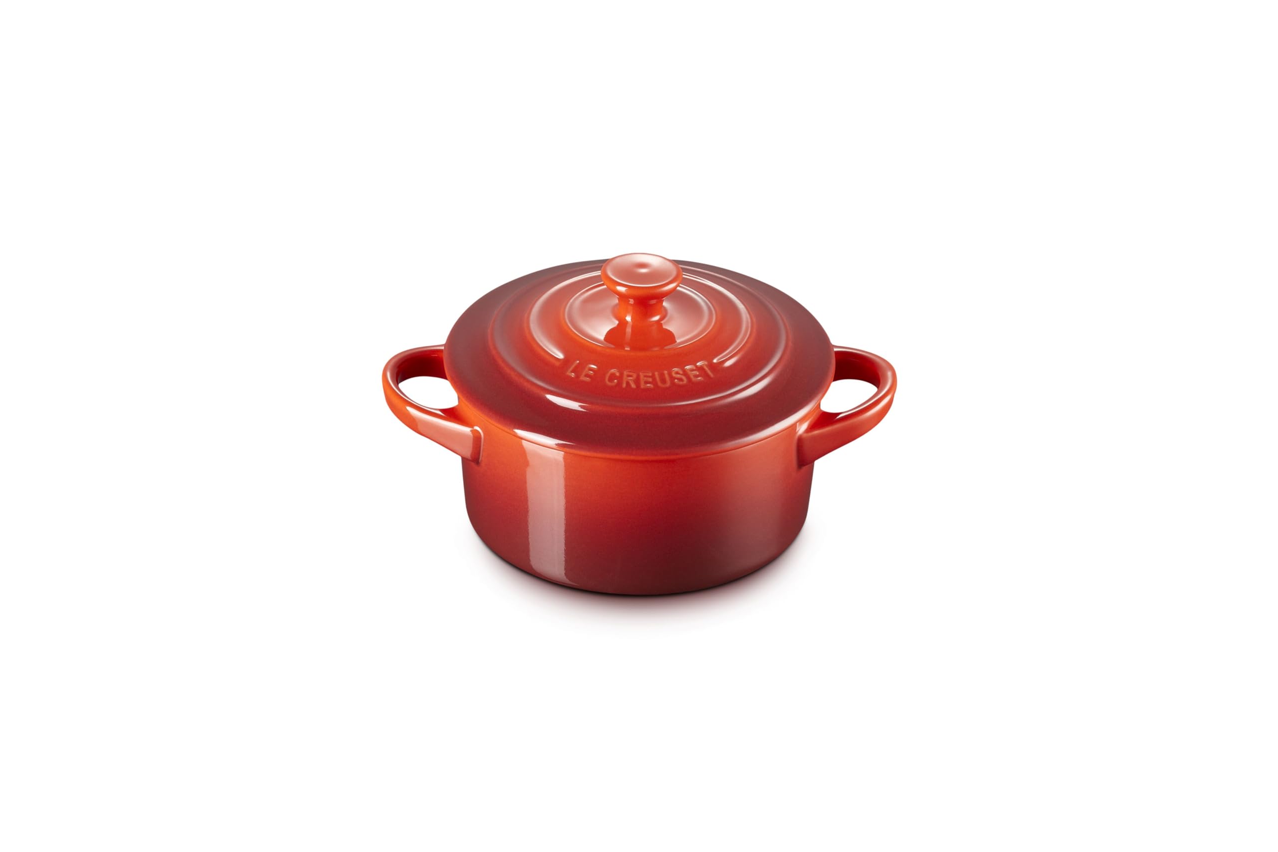 Le Creuset mini cocotte open top view showing interior surface and even cooking benefit