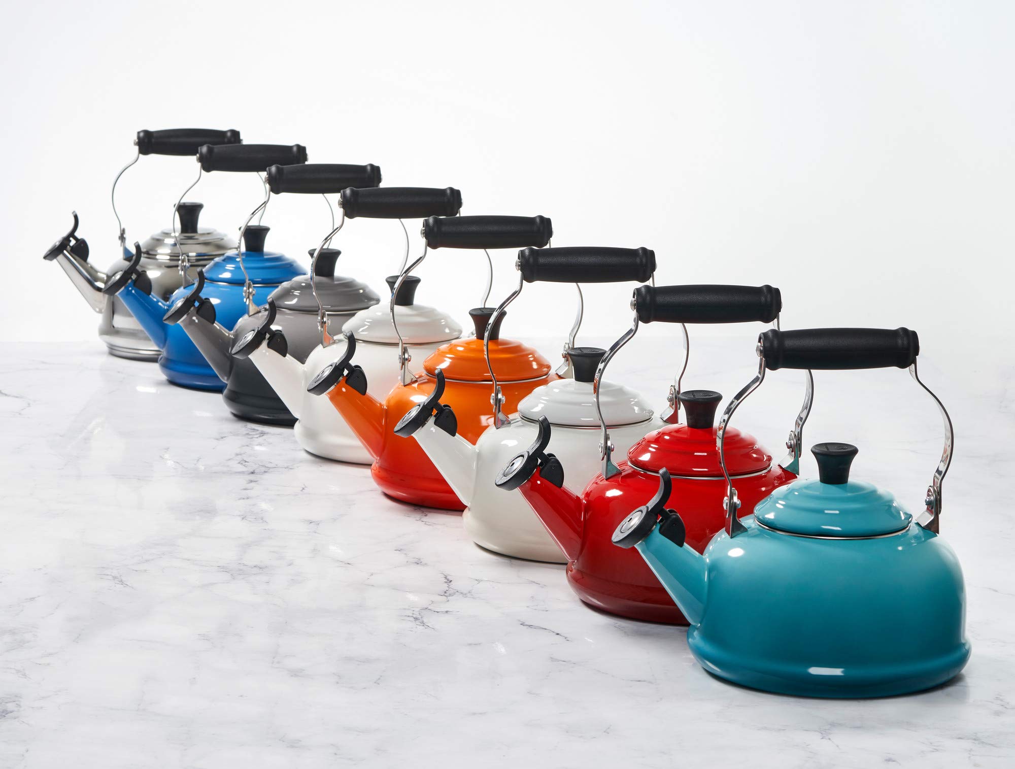 Le Creuset kettle heating on gas cooktop demonstrating fast boil performance