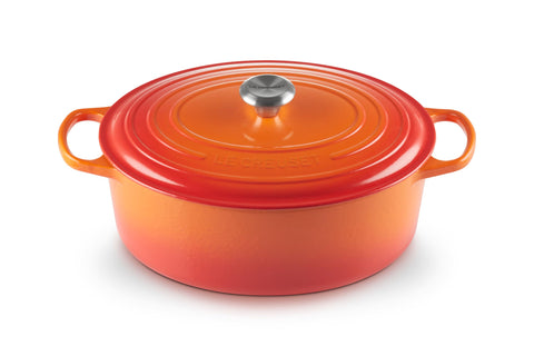 Le Creuset oval Dutch oven front view in Flame showing durable enamel and finish
