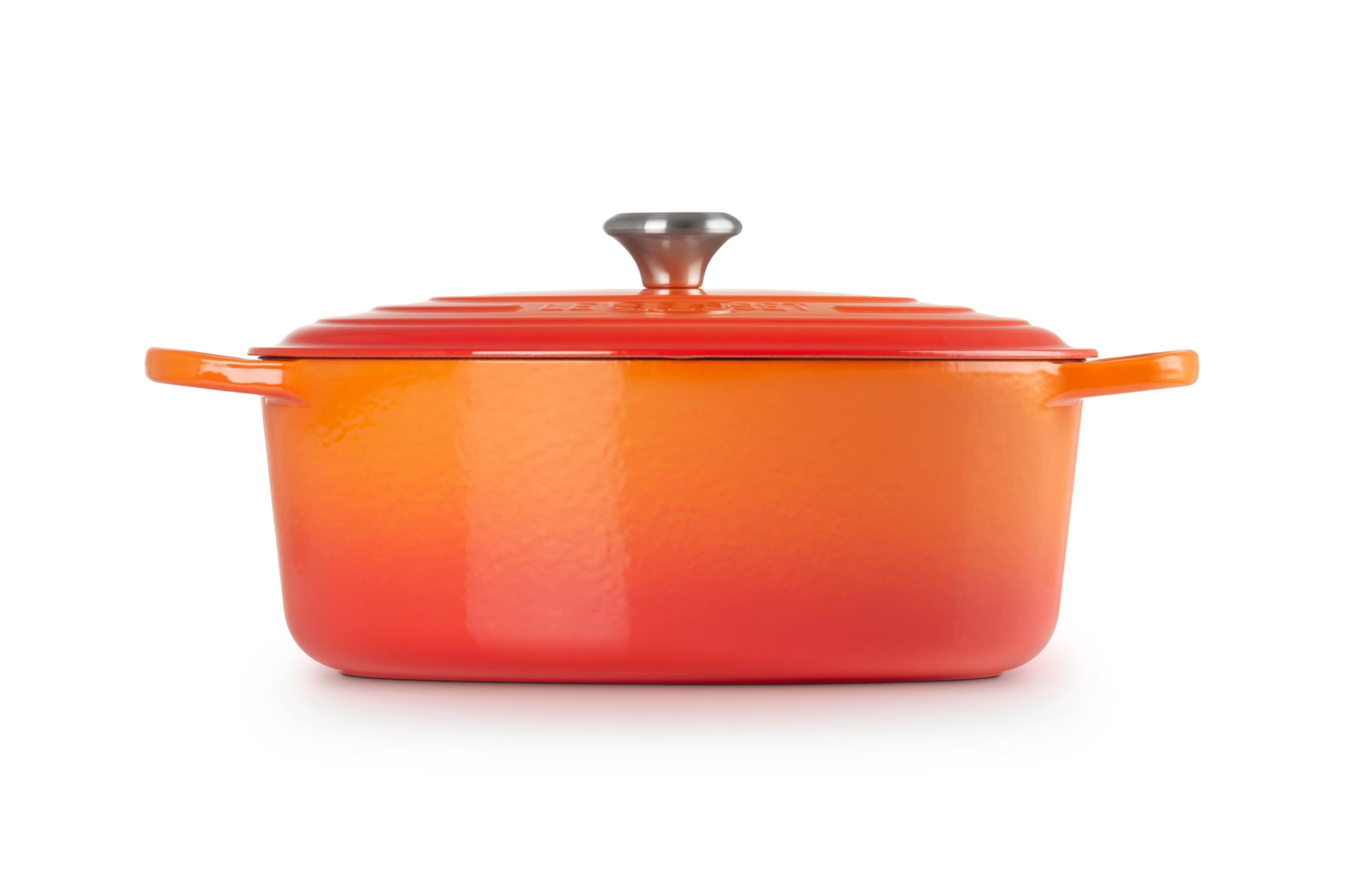 Le Creuset oval Dutch oven with roasted chicken demonstrating even browning