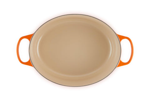 Le Creuset oval Dutch oven interior light enamel showing easy monitoring benefit