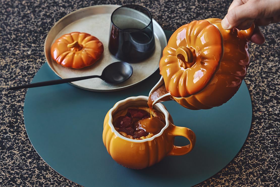 Le Creuset gravy boat beside a spoon to show 14-ounce scale