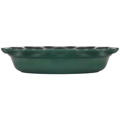 Le Creuset pie dish next to utensils showing 9-inch scale for portion planning benefit