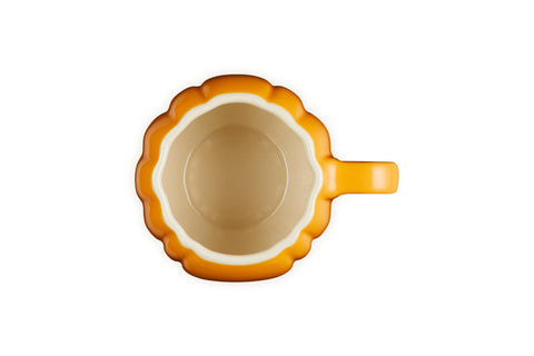 Le Creuset side profile of persimmon mug showing curved walls for comfortable handling