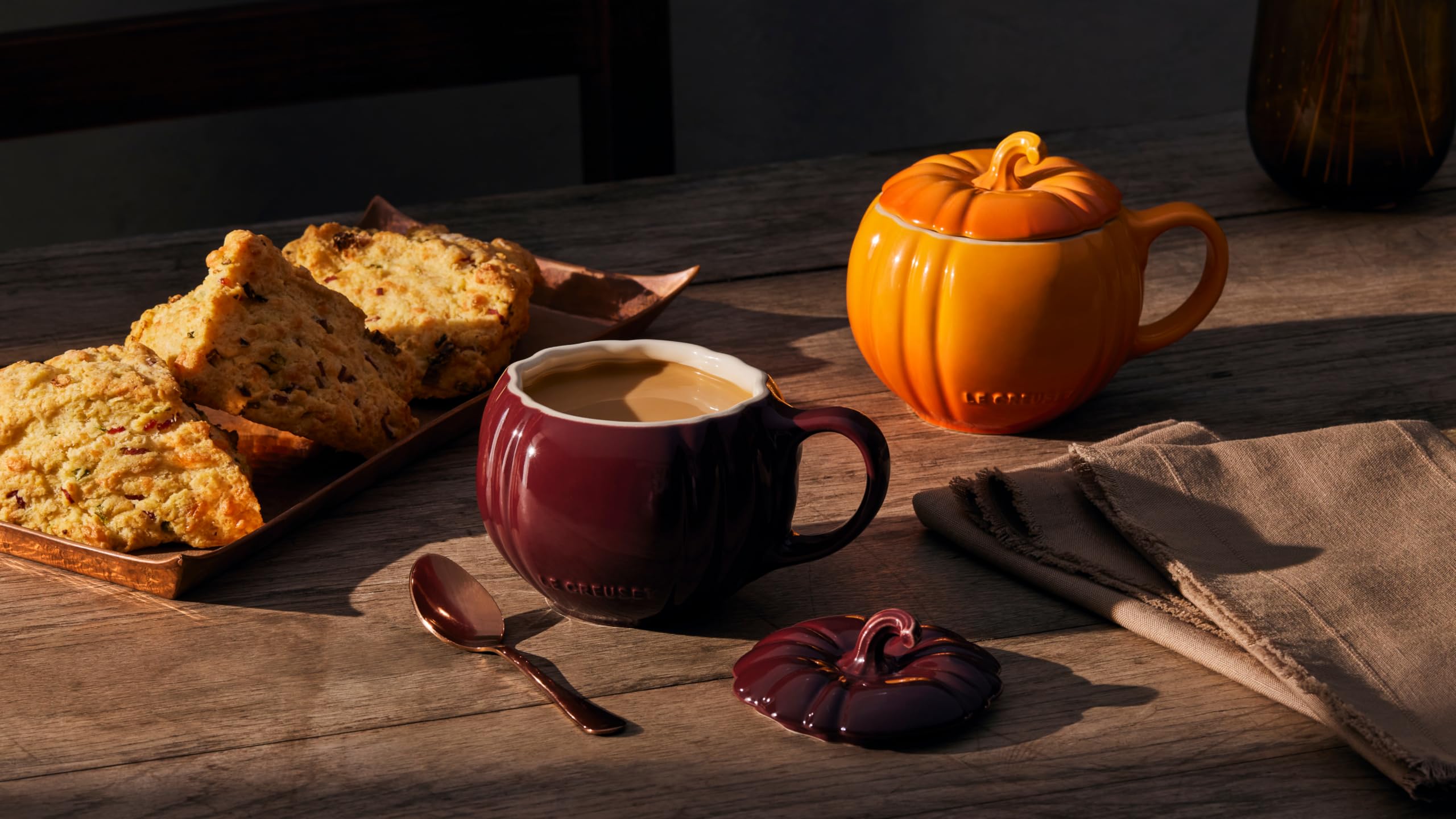 Le Creuset serving soup in pumpkin mug showing single-serve capacity and spoon-friendly opening