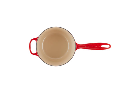 Le Creuset saucepan lid close-up showing tight fit and stainless steel knob for oven use