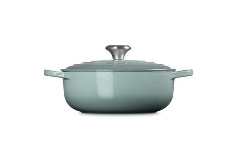 Le Creuset sauteuse roasting chicken in oven demonstrating even heat and oven-safety