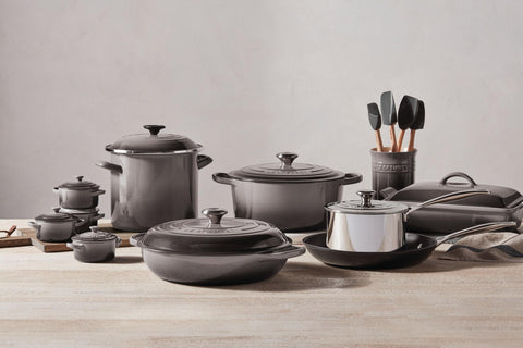 Le Creuset tool held in hand for scale shows comfortable ergonomic grip and control