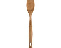 Le Creuset spoon next to measuring spoon to show 12.5-inch reach and balance