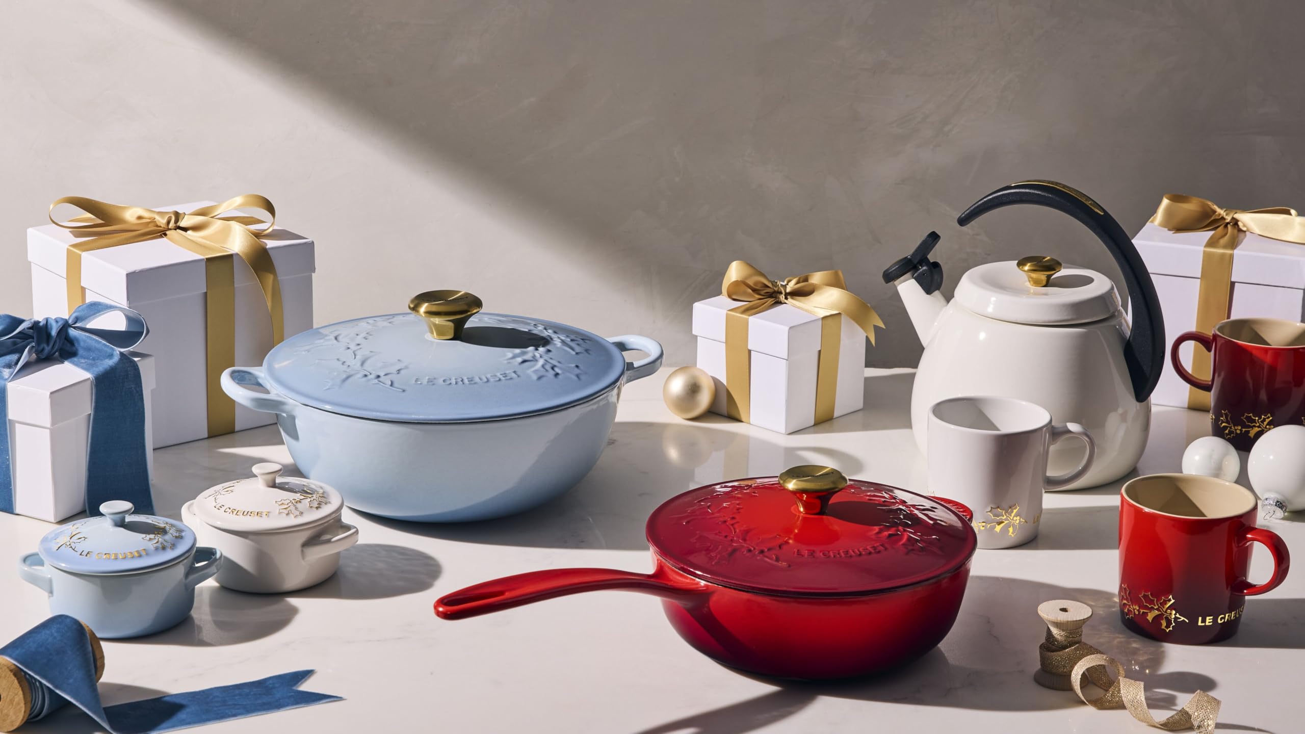 Le Creuset cocotte beside spoon for scale showing compact 8 oz capacity