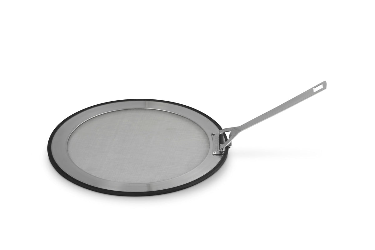 Le Creuset splatter guard front view showing full coverage and sleek rim