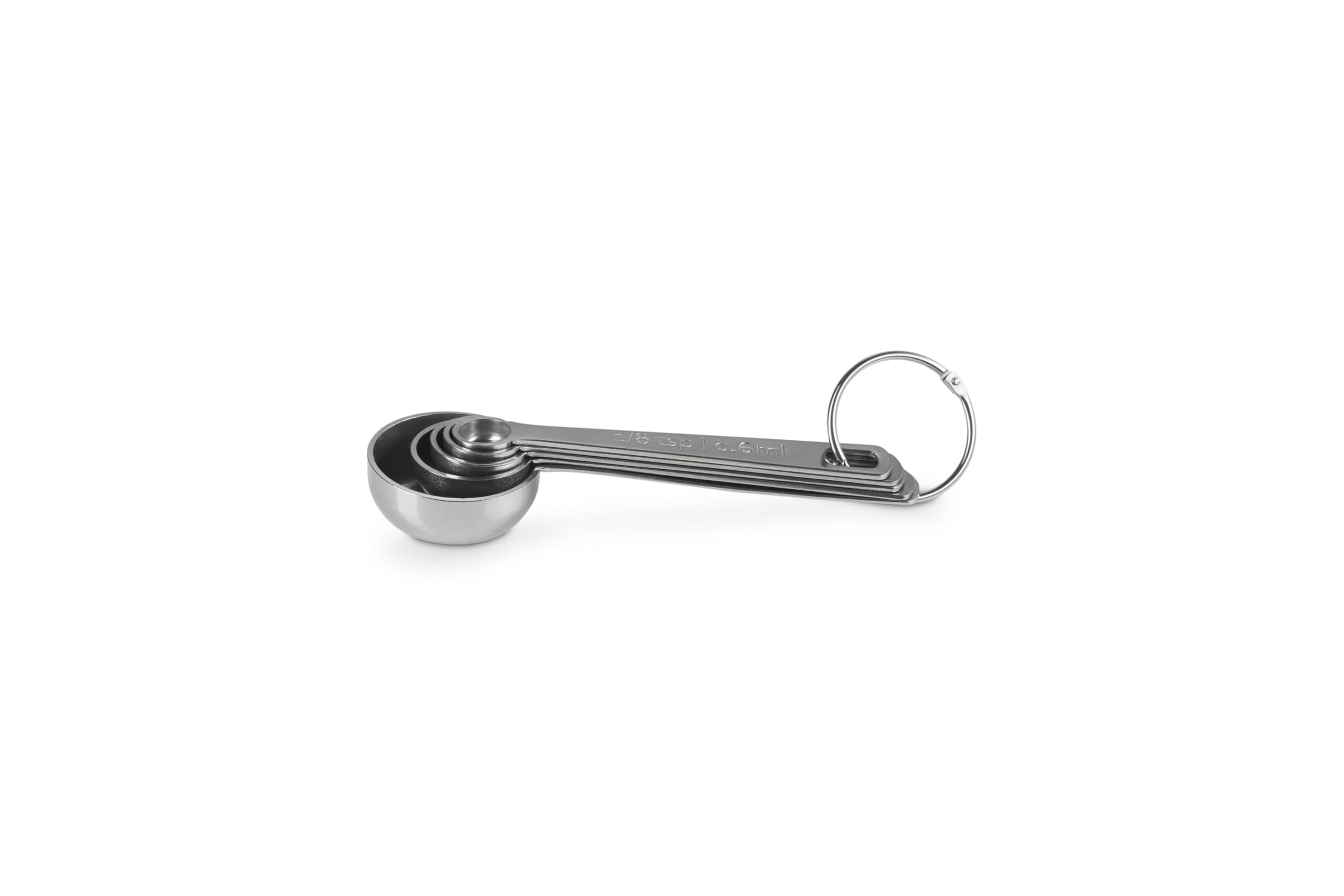 Le Creuset spoon scooping spice showing precision and ease of portioning