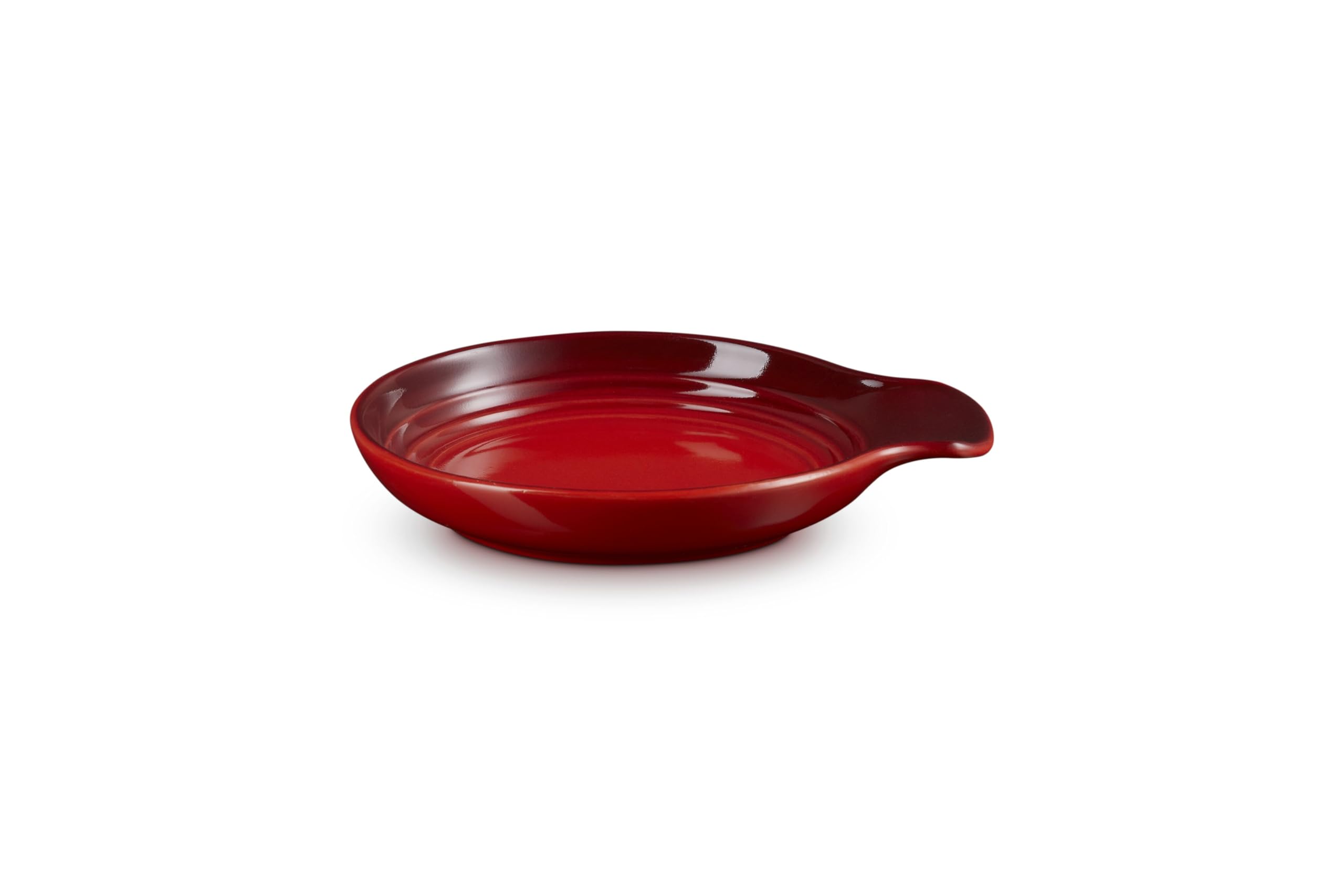 Le Creuset spoon rest beside spatula demonstrating size and capacity