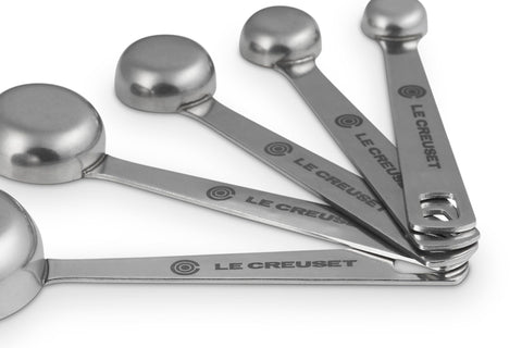 Le Creuset measuring spoons on connecting ring hanging for organized storage
