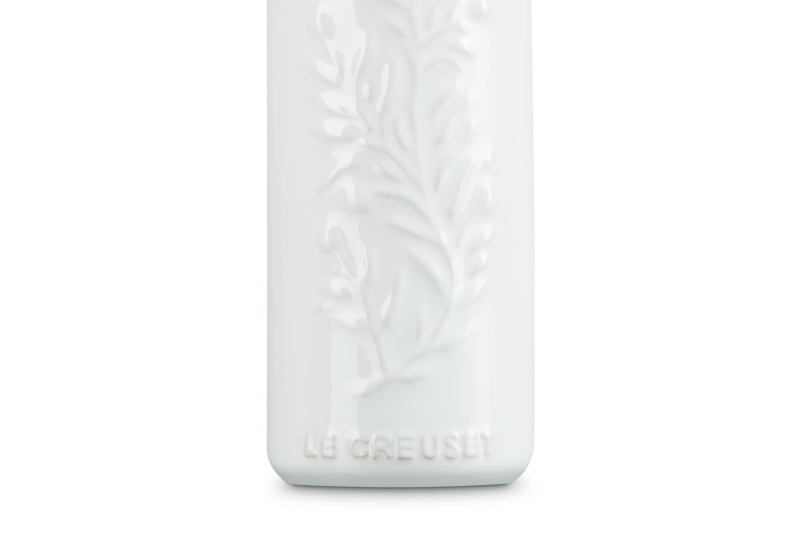 Le Creuset stainless steel nozzle pouring olive oil for precise drip‑free control