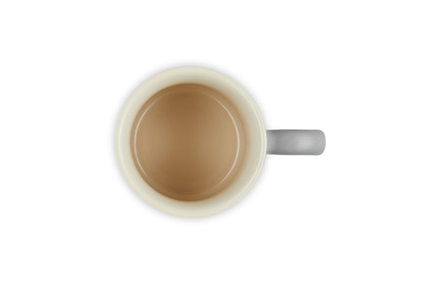 Le Creuset Vancouver mug held in hand to show true 14 oz scale and proportion