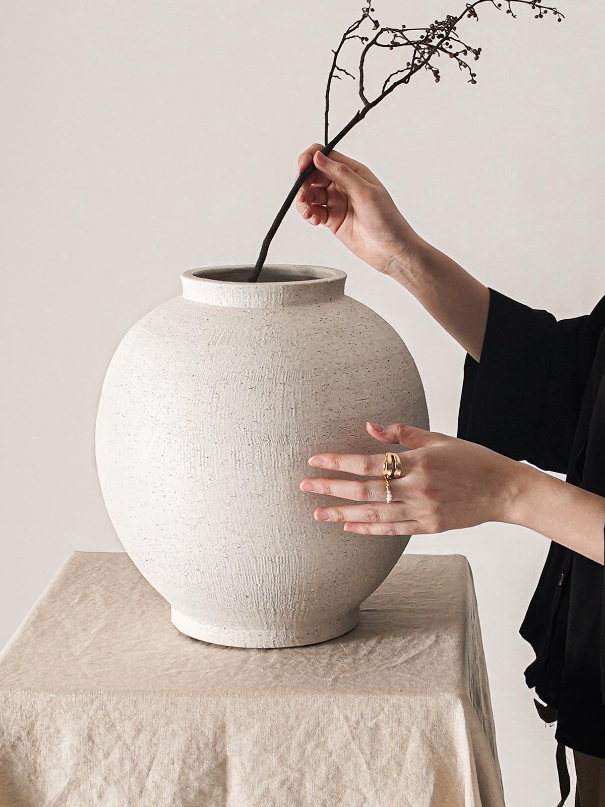 LE TAUCI GARDEN vase beside chair illustrates size and floor placement benefit