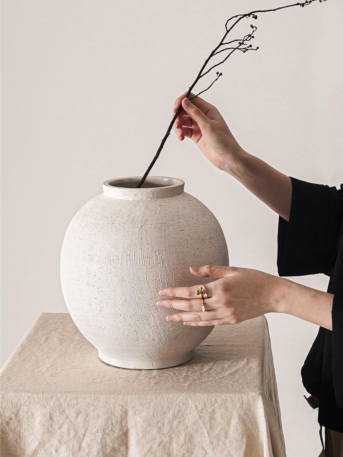 LE TAUCI GARDEN vase beside books showing scale and spatial balance benefit