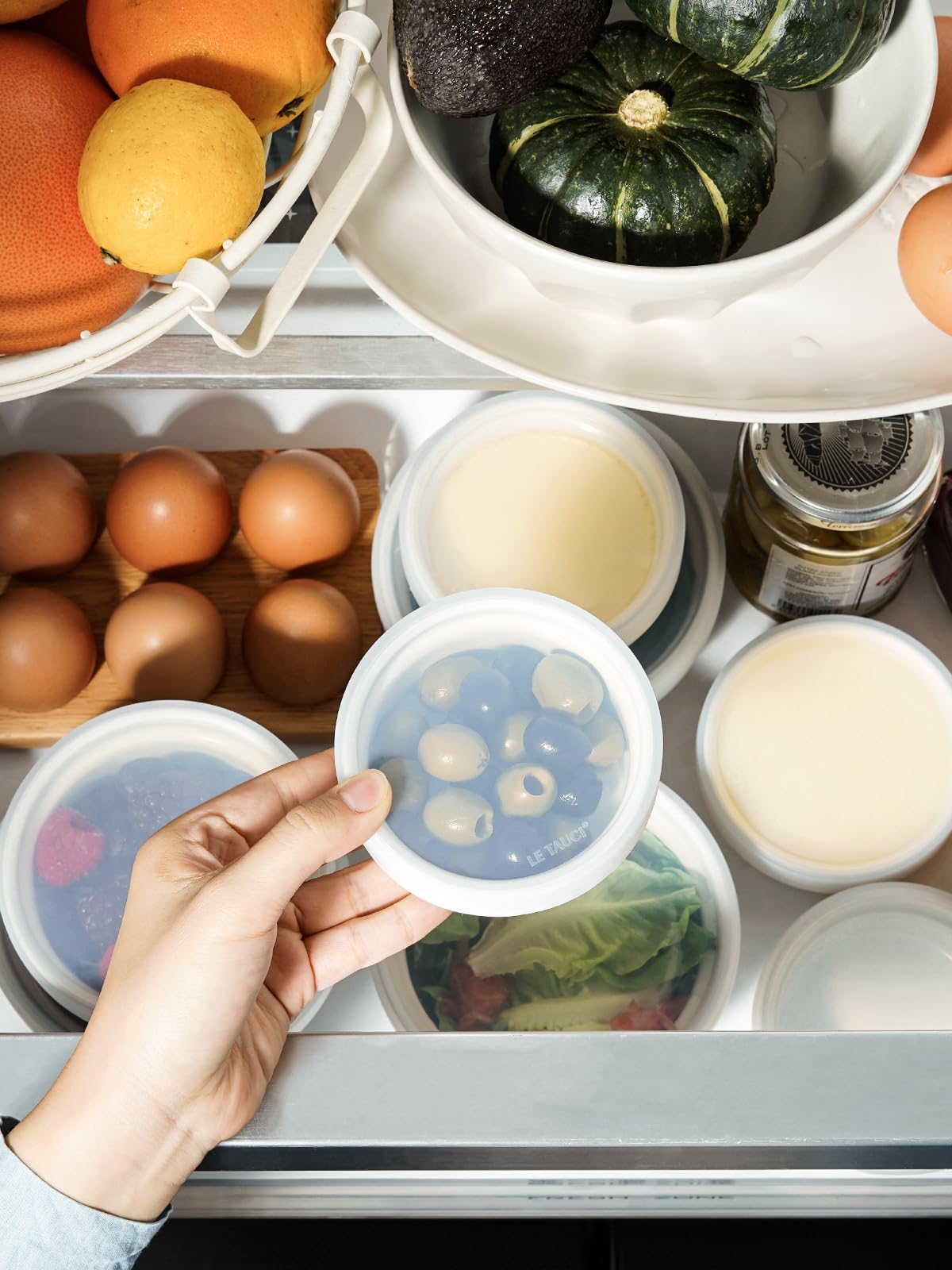 LE TAUCI stacked ramekins illustrating space-saving storage in a kitchen cabinet
