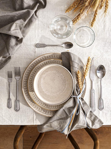 LE TAUCI close-up of embossed wheat texture highlighting rustic tactile detail