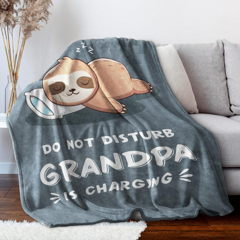 Leebbsin blanket in use with grandpa on couch providing cozy warmth