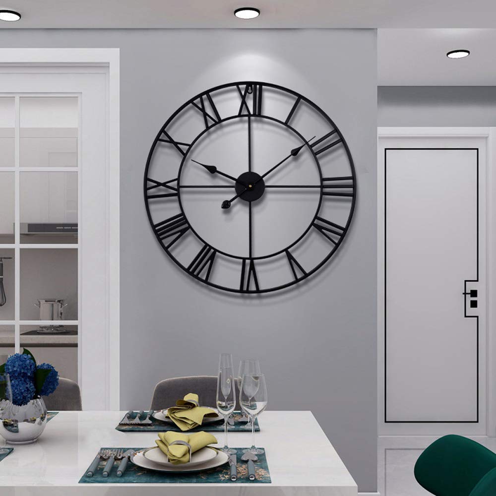 LEIKE front view of black metal Roman wall clock showing bold design and clear time