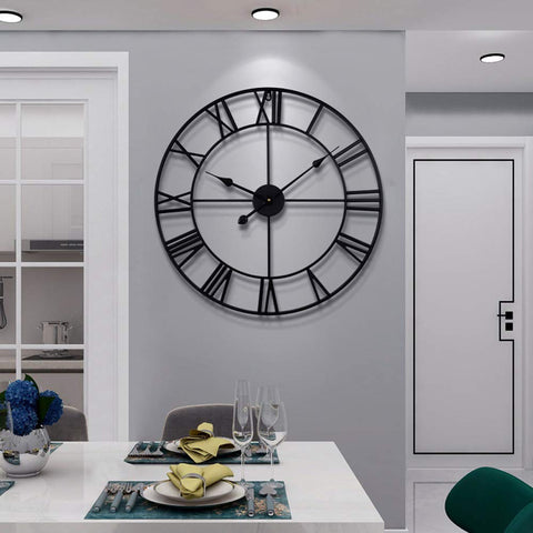 LEIKE front view of black metal Roman wall clock showing bold design and clear time