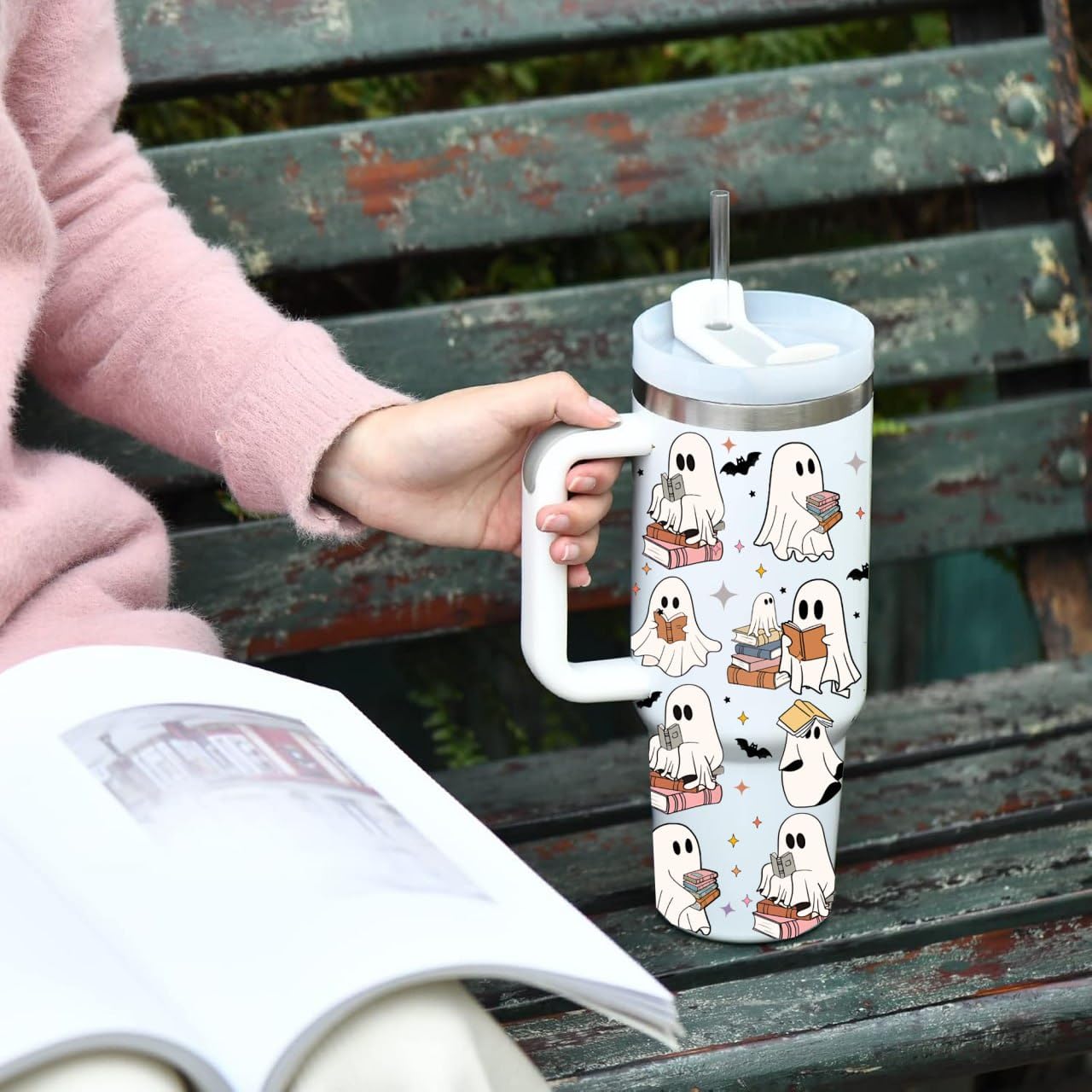 LEISAC tumbler in use beside book showing seasonal lifestyle benefit